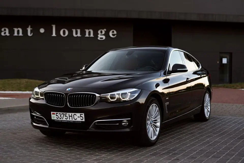 Luxury black BMW parked in a clean, modern setting